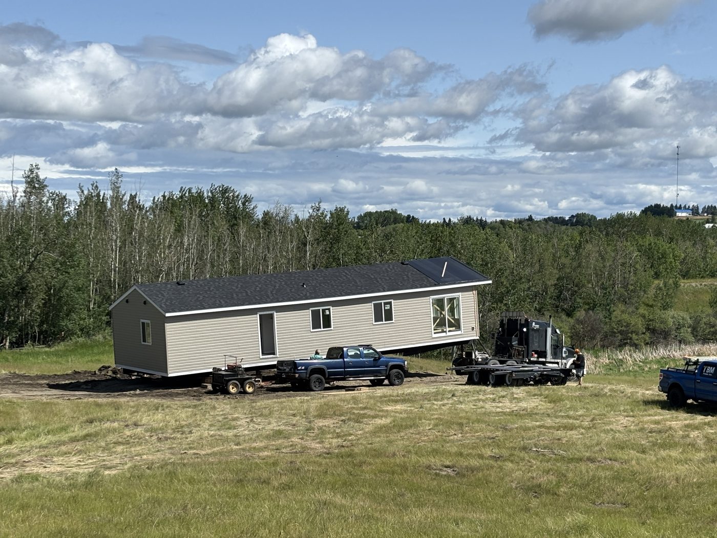 Home being moved onto a cleared acreage lot